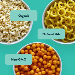 Three bowls of LesserEvil Snacks Flavor-FULL Snacks Box varieties on a teal background: Homers Blend Popcorn, Onion Moonions, and Pizza Space Balls.