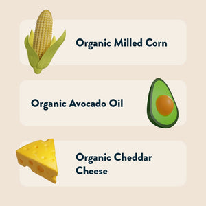 Illustrations of corn, avocado, and cheese highlight LesserEvil Cowboy Cheddar Cheezmos made with Organic Milled Corn, Avocado Oil, and Cheddar Cheese.