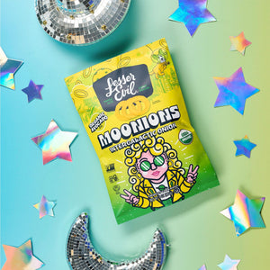 A bag of Flavor-FULL Snacks Box by LesserEvil Snacks on a pastel background with holographic stars, a crescent moon, and a disco ball.