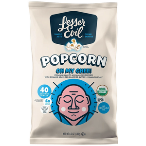 A bag of OrganicPopcorn Oh My Ghee! Gourmet Popcorn with a cartoon face, calorie info, USDA organic label, and a clean cream-colored design.