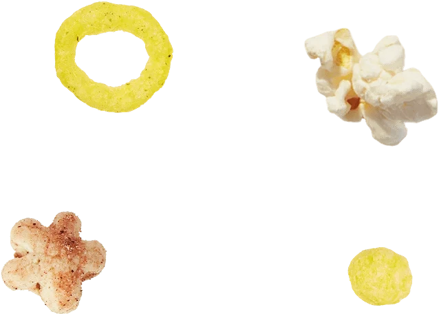 Assorted snacks on a transparent background, including a popcorn piece, a yellow ring, a star-shaped chip, and a small yellow round snack.