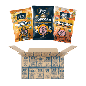 Three bags of LesserEvil Snacks Cheesy Snack Box are shown above an open box of organic cheddar popcorn, all with playful, colorful packaging.