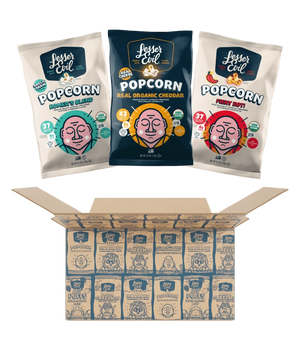 Three bags of LesserEvil Snacks Big Flavor Popcorn Box sit above an open box filled with multiple smaller popcorn bags neatly arranged in rows.