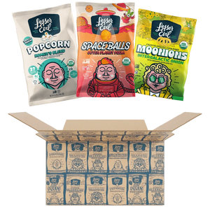 Three colorful snack packs rest above an open LesserEvil Snacks Flavor-FULL Snacks Box filled with individually wrapped treats.