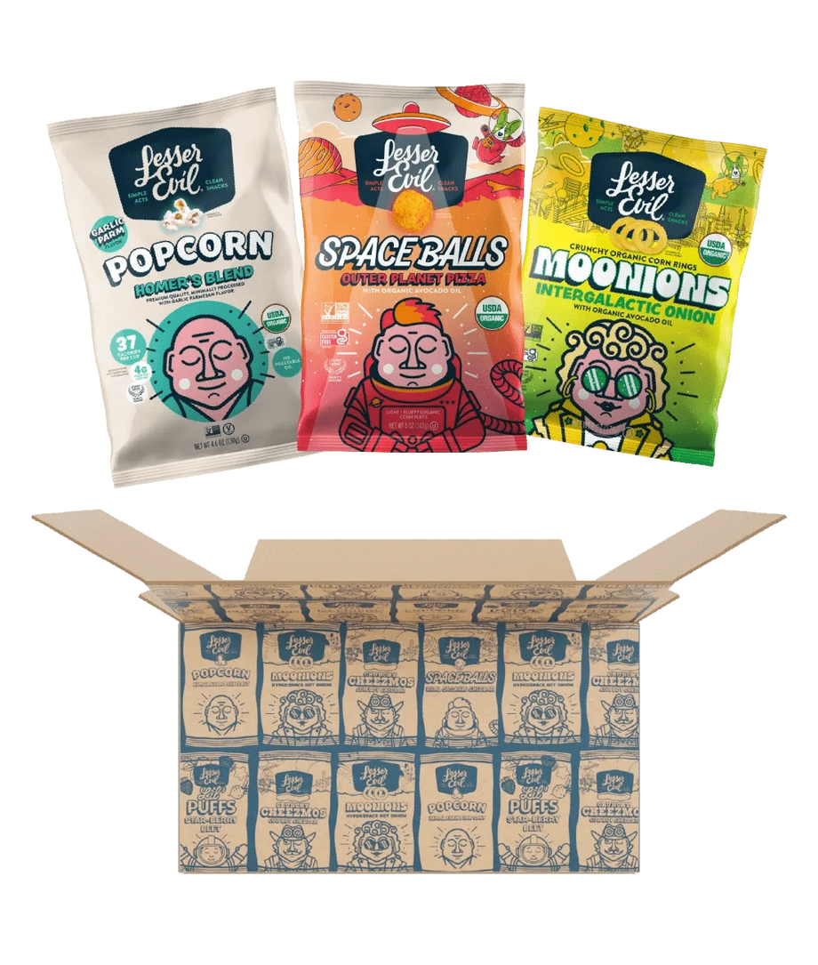 Three colorful snack packs rest above an open LesserEvil Snacks Flavor-FULL Snacks Box filled with individually wrapped treats.
