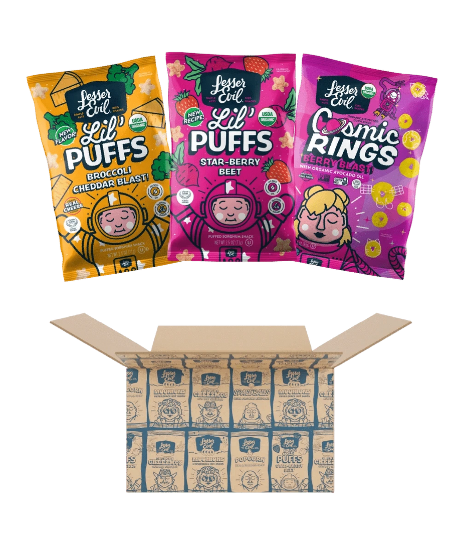 Three bags of LesserEvil Snacks’ Lil Favorites Kids Snacks sit above an open branded shipping box.
