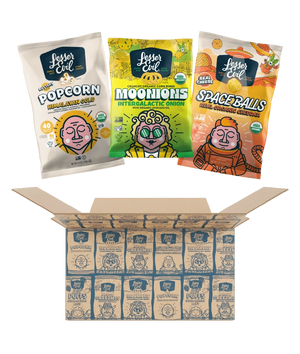 Three vibrant LesserEvil Snacks—Himalayan Gold Popcorn, Real Organic Cheddar, and Intergalactic Onion Moonions—sit atop an open Snacktime Box filled with delicious treats.