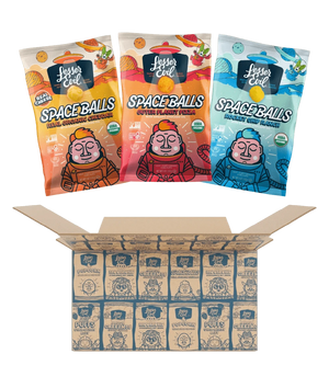 Three colorful bags of Ziggys Stars Space Balls by LesserEvil Snacks are shown above an open box, each with a cartoon astronaut.