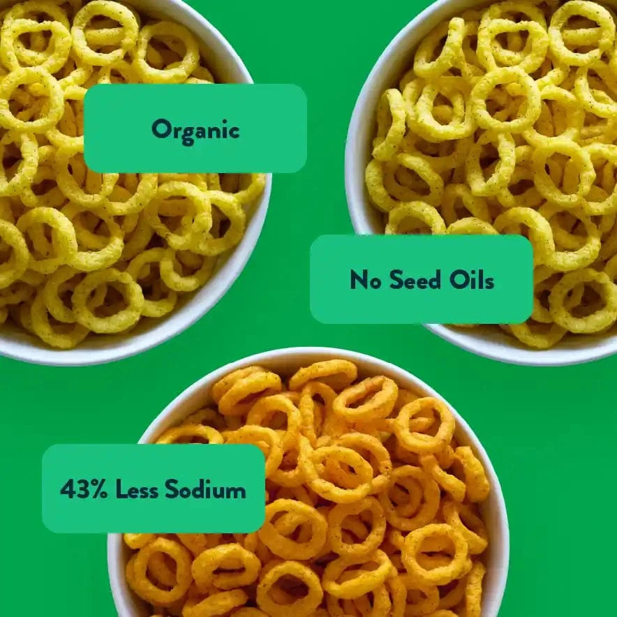 Three bowls of Rheas Recos Moonions Box by LesserEvil Snacks on green, labeled Organic, No Seed Oils, 43% Less Sodium—a tasty variety for any craving.