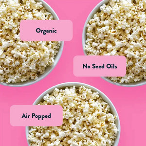 Three bowls of popcorn labeled Organic, No Seed Oils, Air Popped—just like our 0.46 oz Himalayan Pink Salt Organic Popcorn 24 Pack from LesserEvil Snacks.