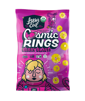 A pink bag of LesserEvil Berry Blast Cosmic Rings organic corn snacks, made with avocado oil and fruit powders, features space-themed art and a blond-haired character on the front.