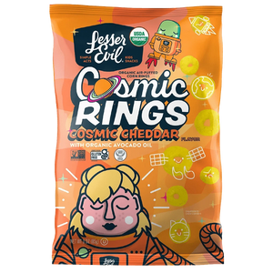 A bright orange bag of LesserEvil Cosmic Cheddar Cosmic Rings vegan snacks features space-themed graphics and a cartoon astronaut with cheese rings.