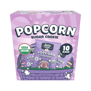 The LesserEvil Snacks Easter Sugar Cookie Popcorn Snack Box has 10 USDA Organic bags, coconut oil, and playful popcorn graphics—making it a perfect springtime treat.