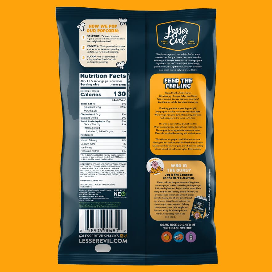 Back of an OrganicPopcorn Real Organic Cheddar Popcorn bag with nutrition facts, popping process, brand story, and icons; orange and white text pops on dark packaging.