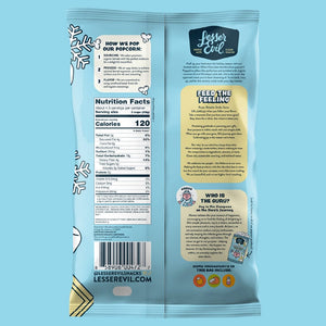 The back of a blue LesserEvil White Chocolate Marshmallow popcorn bag shows nutrition facts, popping tips, brand info, social links, festive snowflakes—your perfect holiday snack!.