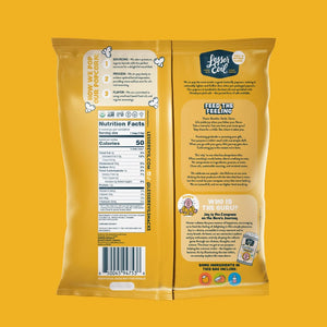Back of a yellow LesserEvil Himalayan Gold Organic Butter Flavor Popcorn Snack Pack shows nutrition facts, organic coconut oil, plant-based butter, brand story, barcode, and snack images.