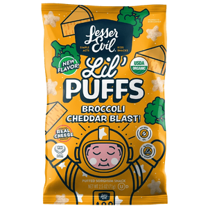 A yellow bag of LesserEvil Broccoli Cheddar Blast Lil Puffs features cartoon cheese, broccoli, and an astronaut, labeled USDA Organic and made with real cheddar cheese.