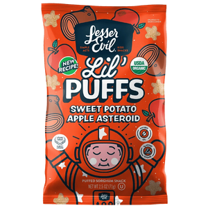 LesserEvil Sweet Potato Apple Asteroid Lil Puffs come in a bright orange bag with 0g added sugar, star-shaped puffs, and a cartoon astronaut on the packaging.