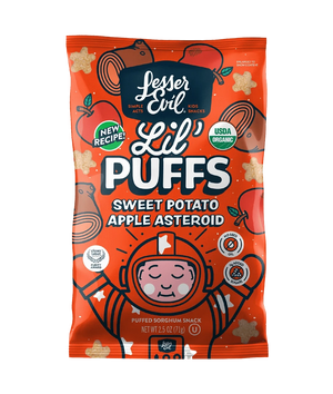 LesserEvil Sweet Potato Apple Asteroid Lil Puffs come in a bright orange bag with 0g added sugar, star-shaped puffs, and a cartoon astronaut on the packaging.