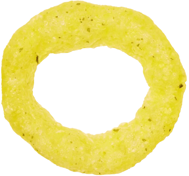 A single yellow, ring-shaped snack chip with a rough texture and small green seasoning specks, viewed from above on a transparent background.