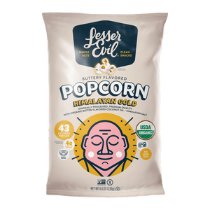 A bag of LesserEvil Himalayan Gold Organic Butter Flavor Popcorn with a meditative face, plant-based butter, organic coconut oil, and USDA Organic details on a light background.