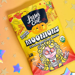 A vibrant bag of LesserEvil Hyperspace Hot Onion Moonions shows a curly-haired cartoon astronaut with sunglasses on a yellow-orange background with shiny stars.