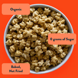 LesserEvil Sweet Potato Apple Asteroid Lil Puffs on an orange background—Organic, 0g added sugar, baked not fried—an apple snack kids will love.