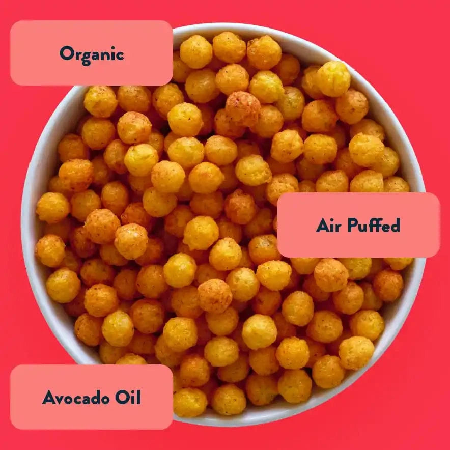 A white bowl of SpaceBalls Outer Planet Pizza—round, yellow-orange puffs on red, labeled organic, air puffed, avocado oil.