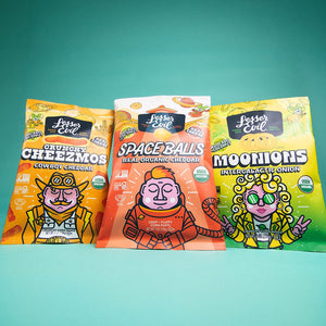SpaceBalls Real Organic Cheddar Space Balls: a colorful, cartoon astronaut snack bag made with clean ingredients and organic cheddar.