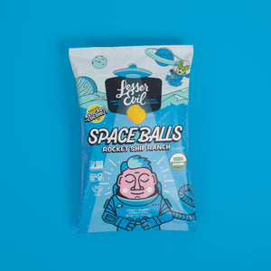 A bag of SpaceBalls Rocket Ship Ranch Space Balls with cartoon space and astronaut art on blue, featuring a dairy-free ranch flavor.