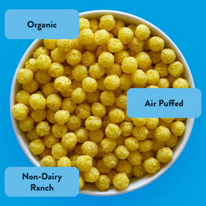 A bowl of SpaceBalls Rocket Ship Ranch Space Balls labeled Organic, Air Puffed, and dairy-free ranch sits on a bright blue background.