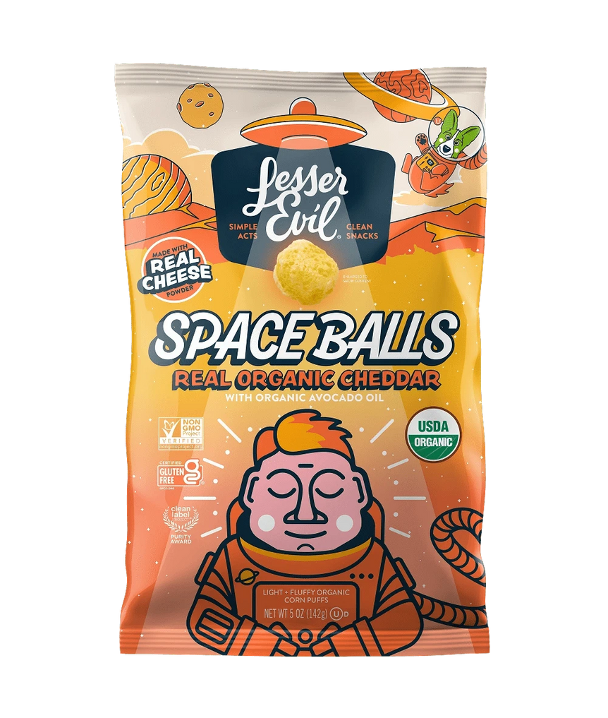 A bag of SpaceBalls Real Organic Cheddar Space Balls features a cartoon astronaut and space-themed artwork on the packaging.