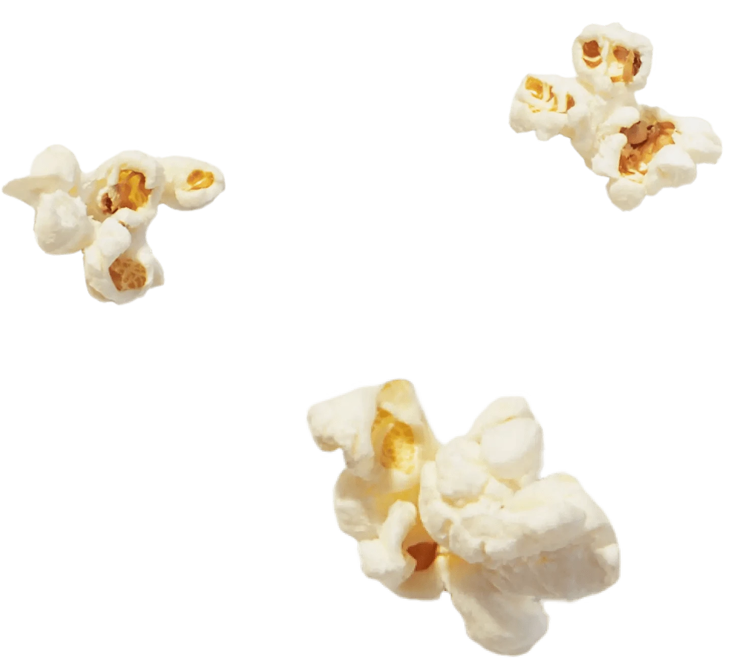 Three pieces of popped popcorn are scattered on a transparent background.
